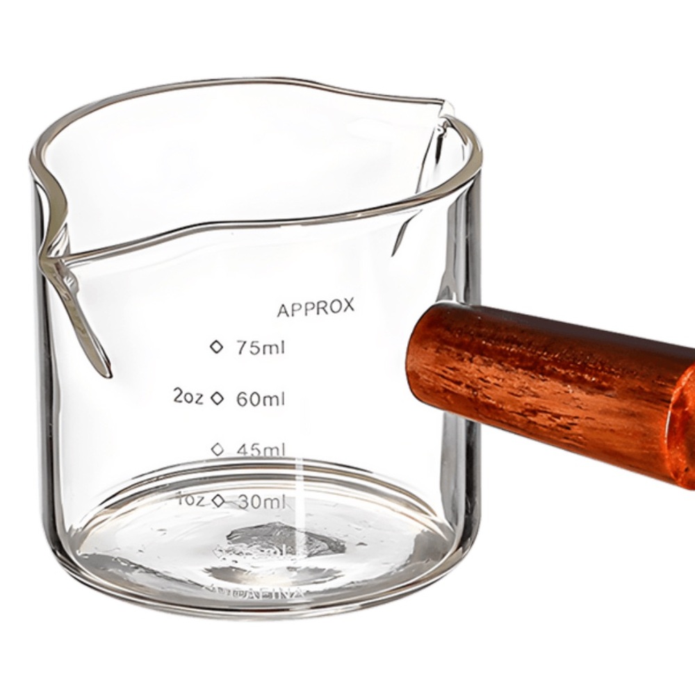 clear glass cup with wooden handle